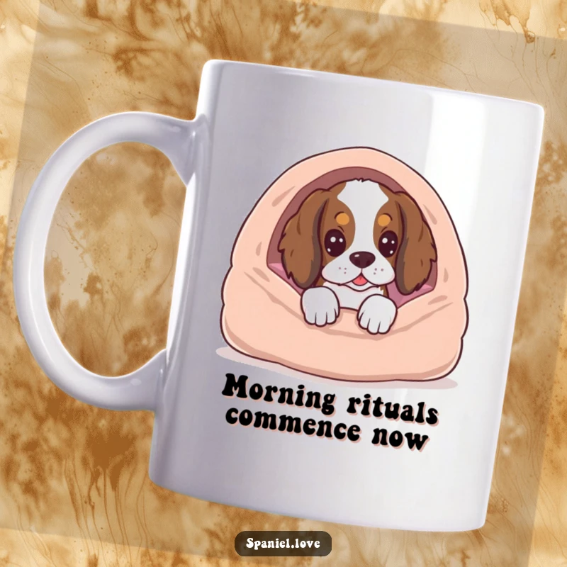 Funny Spaniel peeking excitedly from behind a plush dog bed, waiting for a treat, on a ceramic mug.