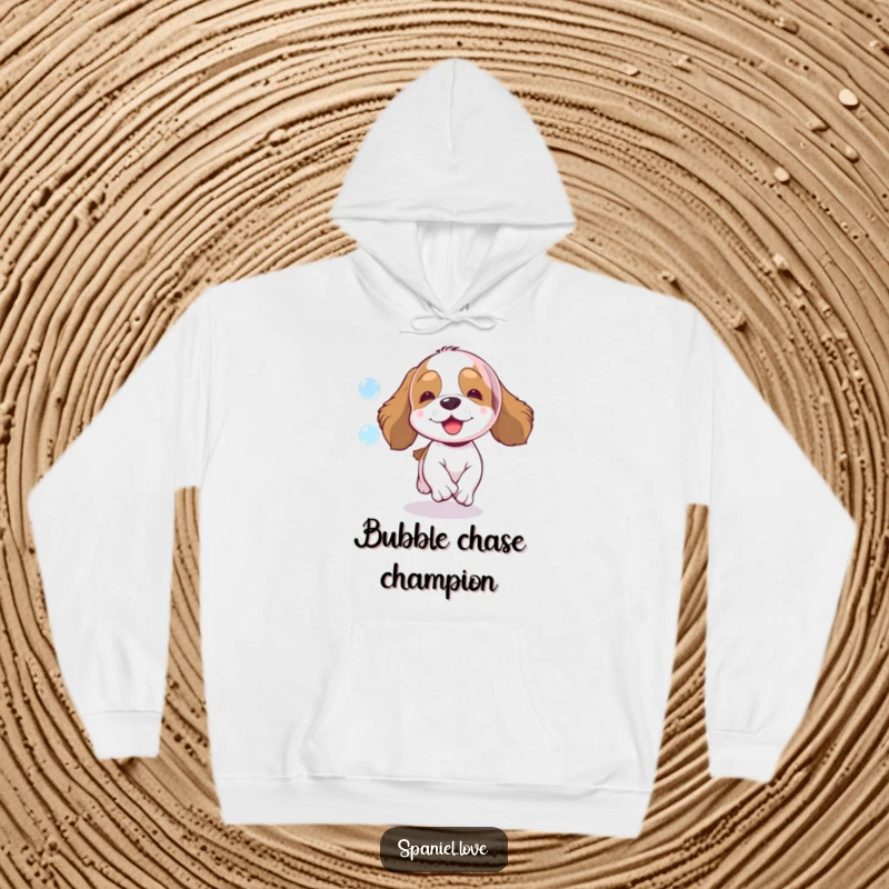 Funny spaniel hoodie, a happy spaniel dog energetically chasing a colorful, sparkling bubble, ultimate comfort and humor.