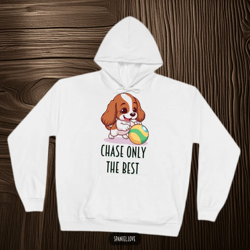 Funny Spaniel Hoodie: A mischievous spaniel actively nudging a vibrant, bouncing ball, radiating playful energy.