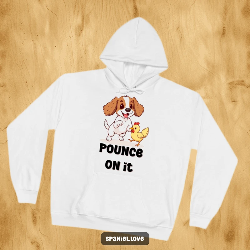 Funny Spaniel Rubber Chicken Pounce Hoodie: A happy spaniel leaps enthusiastically towards a bouncy rubber chicken, ready for action.