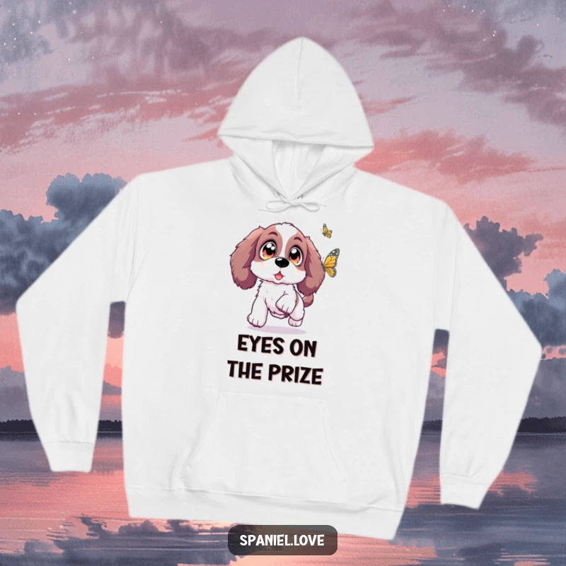 Funny Spaniel hoodie showcasing a Spaniel with oversized, sparkling eyes leaping with excitement towards a butterfly, radiating cozy enchantment.