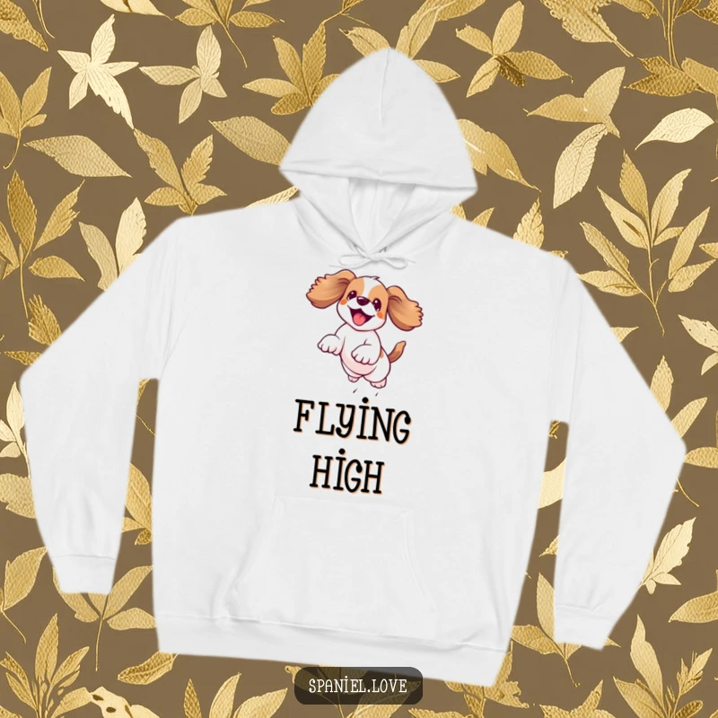 Funny kawaii spaniel leaping joyfully mid-air with floppy ears flying, featured on a cozy hoodie, radiating pure happiness.