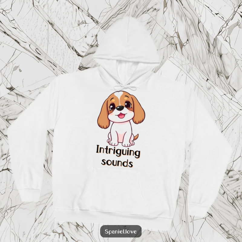 Funny happy spaniel with head tilted, listening intently on a hoodie, perfect for cozy and thoughtful, humorous wear.