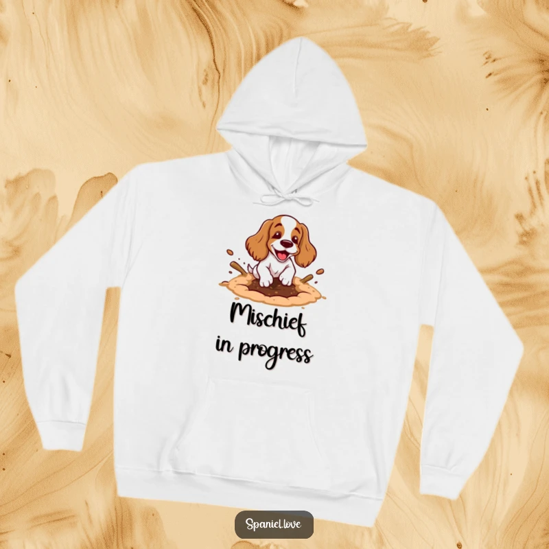 Funny spaniel hoodie featuring a cartoon spaniel happily digging a hole with exaggerated motion and dirt flying, cozy and fun.