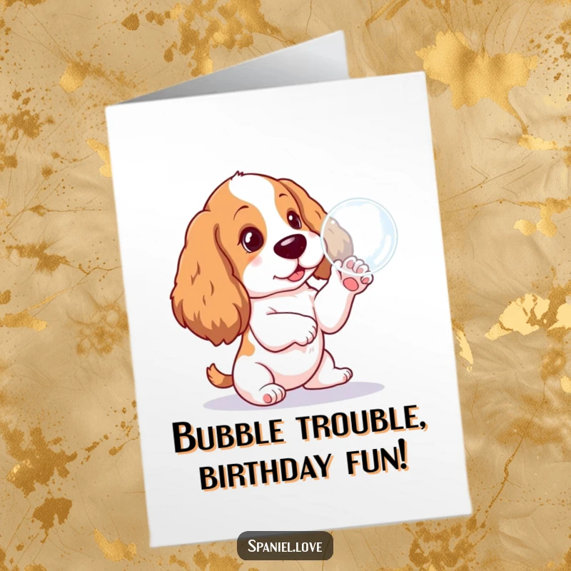 Funny Free Printable Birthday Card: Adorable Spaniel pup joyfully paws at a floating bubble, ready to celebrate.