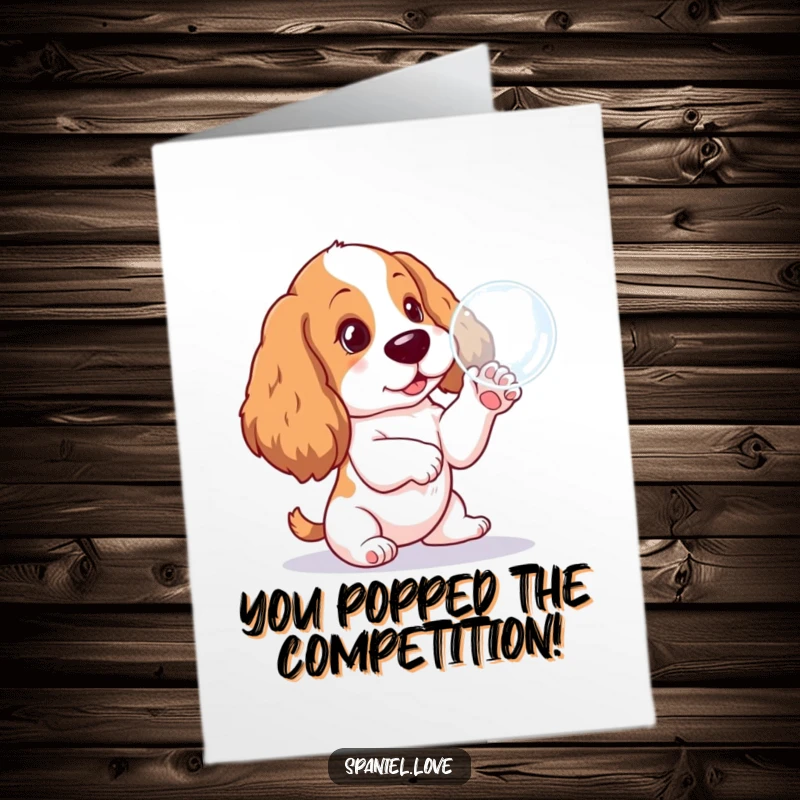 Funny Free Printable Congrats Card: Cute spaniel pup playfully batting at a shimmering bubble, celebrating success.