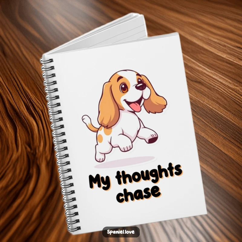 Funny notebook with a spaniel character with floppy ears, joyfully chasing its wagging tail.