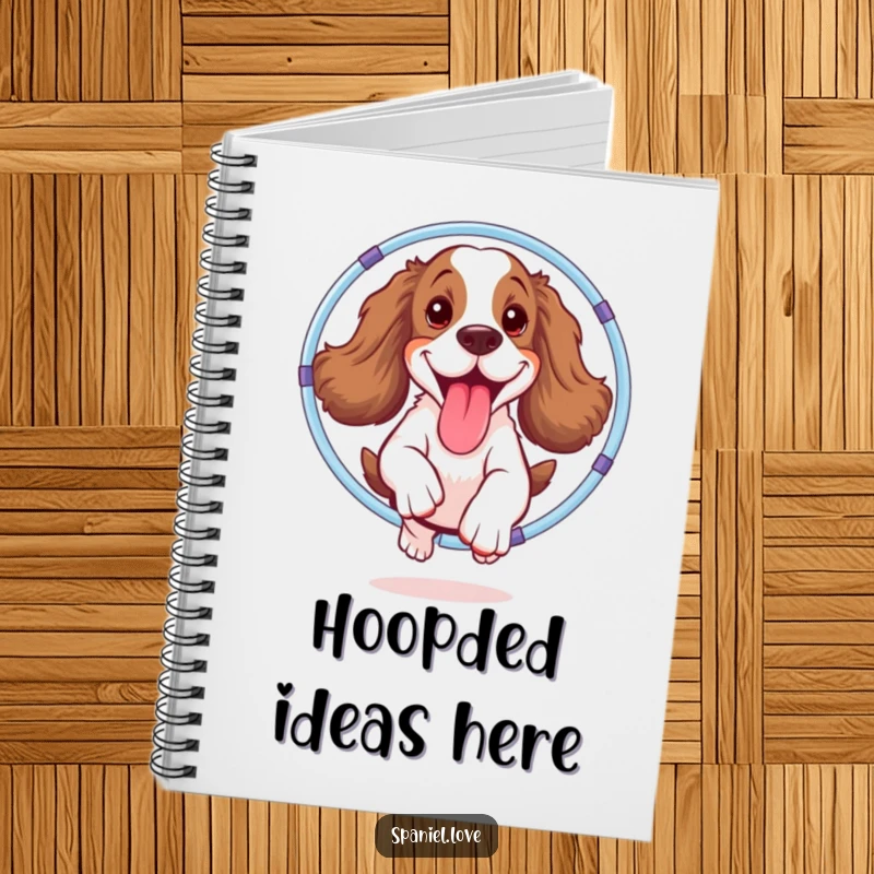 Funny spaniel notebook depicting a joyful dog energetically jumping through a hula hoop, tongue out, perfect for jotting down playful ideas.