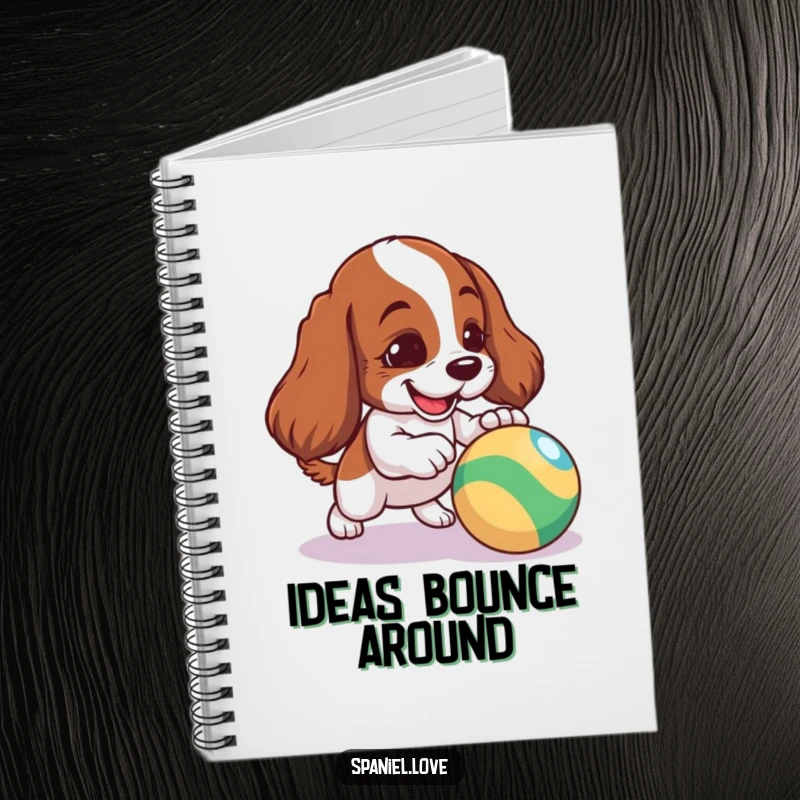 Funny Spaniel Notebook: A mischievous spaniel playfully nudging a colorful bouncing ball, ready for notes.