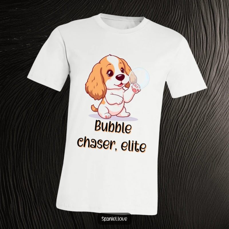 Funny Spaniel pup t-shirt, playfully batting at a floating bubble, showcasing innocent joy and a hilarious canine pastime.
