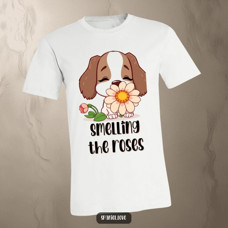 Funny t-shirt showing a happy spaniel character with its nose buried in a comically large, colorful flower.