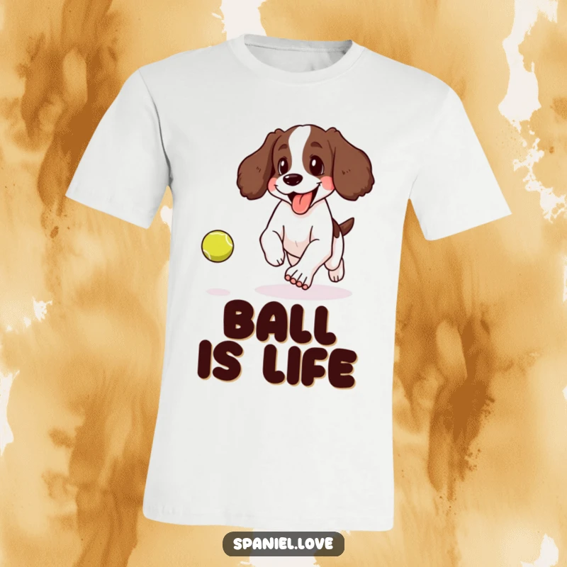 Funny t-shirt depicting a spaniel panting happily with its tongue lolling out, enthusiastically chasing a bouncing tennis ball.