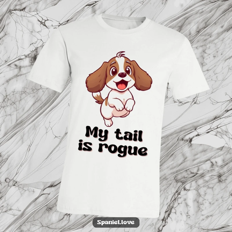Funny t-shirt showing a surprised spaniel character leaping backward from its own furiously wagging tail.