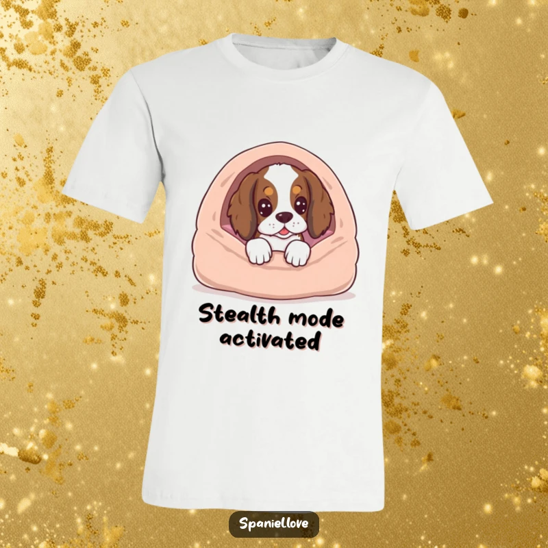 Funny spaniel dog peeking mischievously from behind a cozy bed, looking hopeful, on a humorous t-shirt.
