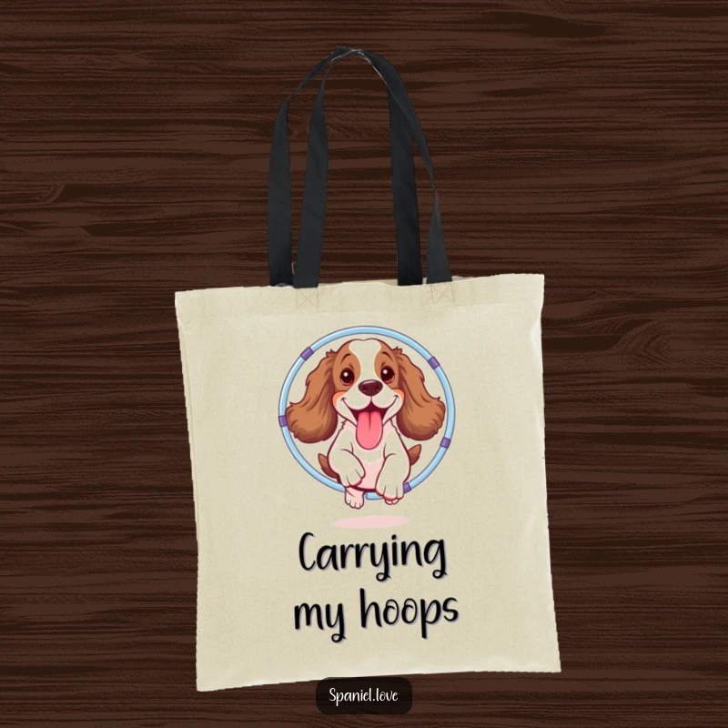Funny spaniel tote bag depicting a joyful dog mid-hula hoop jump, tongue out, ready to carry anything with a dose of fun.