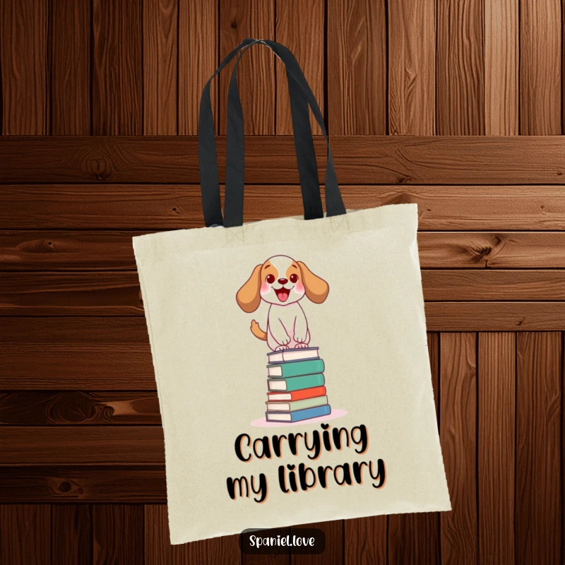 Funny spaniel tote bag depicting an excited dog wagging its tail, balancing on a stack of books, ready to carry your literary finds.