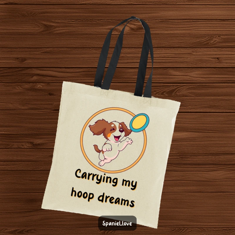 Funny Spaniel Tote Bag: A spaniel leaps through a hoop to catch a frisbee, bringing athletic fun to your travels.