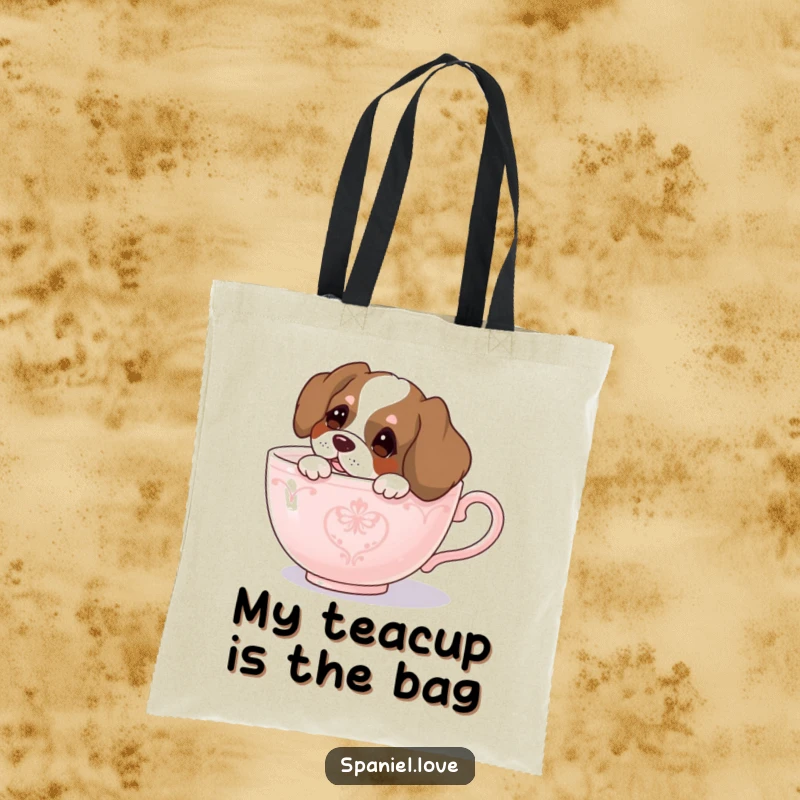 Funny spaniel tote bag, a curious spaniel dog peeking out from a large teacup, practical and full of charm.